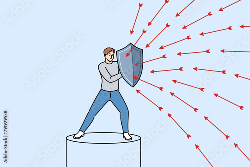Brave man defends himself from problems using shield to deflect flying arrows from enemies. Brave guy demonstrates self-control when faced with business threats or troubles in personal life.