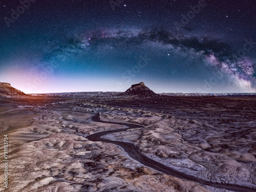 Milky Way Arch over a butte in the Utah Desert photo