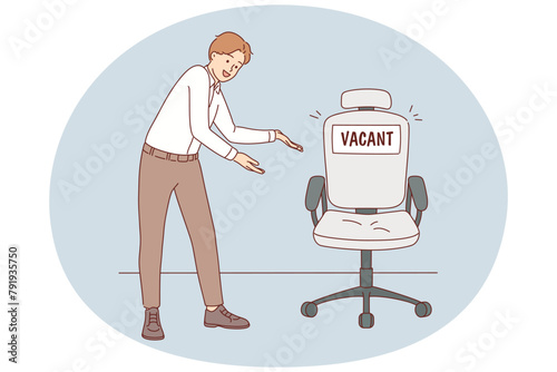 Smiling employer point at vacant chair