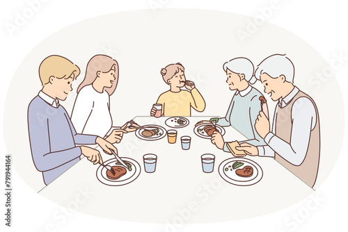 Big family eating dinner at table