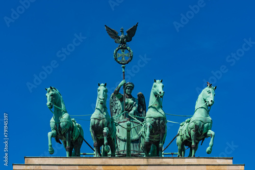 The quadriga at the top of Brandenburg Gate in Berlin, Germany photo