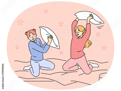 Smiling girls have fun engaged in pillow fight in bedroom. Happy children enjoy pajama party in bed at home. Vector illustration.