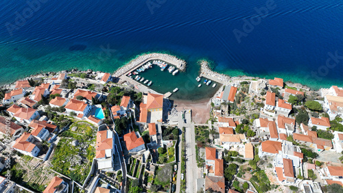 Aerial drone photo of small picturesque seaside village and harbour of Kaminia located near main village of Hydra island accessible by footpath, Saronic gulf, Greece photo