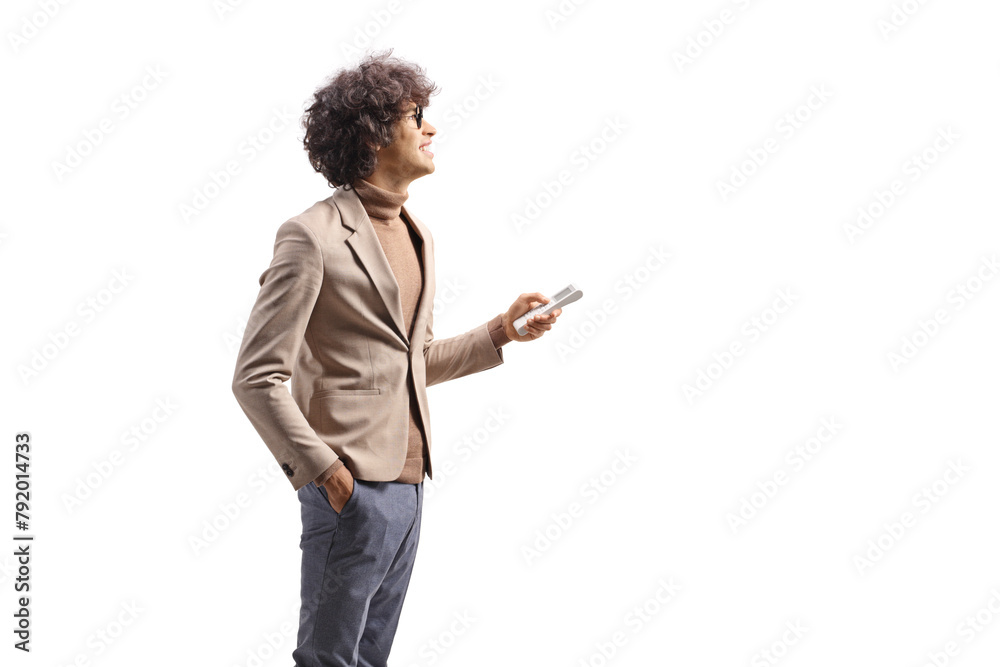 Young man holding a remote controller for air conditioner Young man holding a remote controller for air conditioner