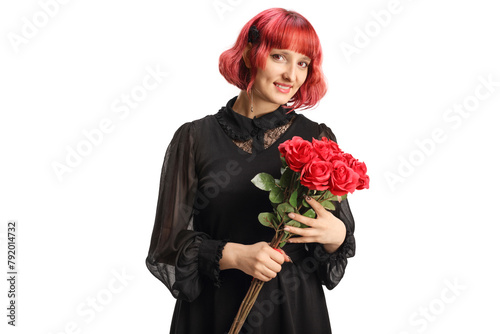 Young woman in a black dress holding a bunch of red roses