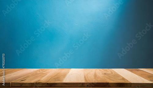 Empty wooden table. Mock up for product display. Blue background. © hardvicore
