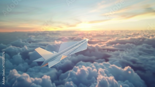 A paper plane is flying in the sky above the clouds. The sun is setting in the background. sunset