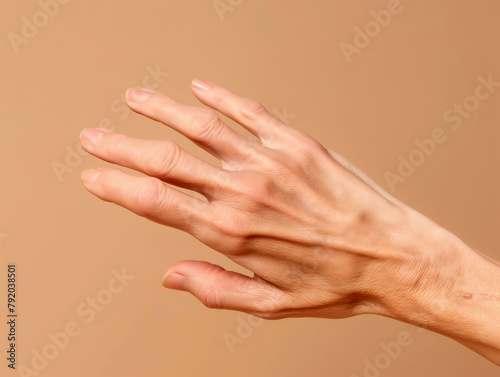 Human hand reaching out gesture on a beige background. Concept of assistance  connection  and human interaction. Design for social advertisement  poster  and healthcare communication with place for te