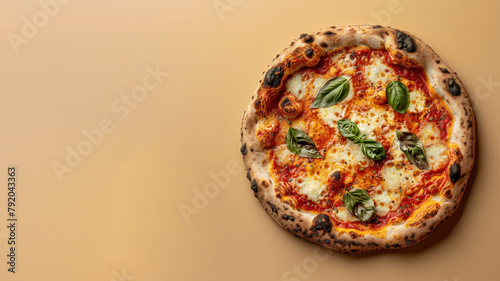 Top view of pepperoni Pizza isolated on beige background