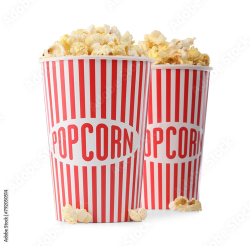 Tasty fresh popcorn in buckets isolated on white