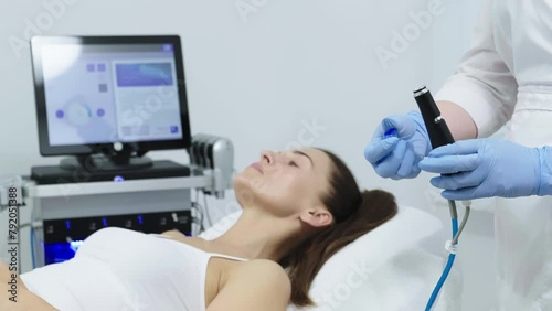 A doctor performs cosmetic procedures for rejuvenation and facial cleansing on a middle-aged patient in a cosmetology clinic. Hydropic cosmetic procedure, facial cleansing, clean skin. photo