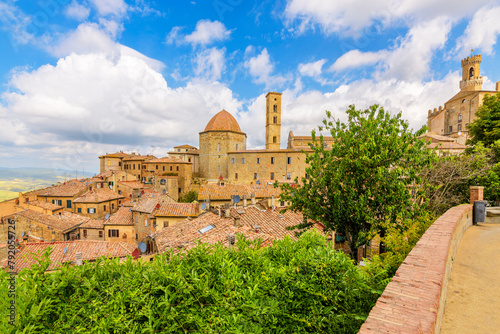 View from a terrace overlooking the townscape, countryside and skyline of the medieval hilltop village of Volterra, in the Tuscany region of Italy.