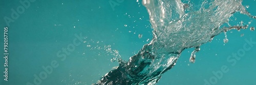 Super slow motion of water splash on black backgro  Super slow motion of water splashes on a turquoise photo