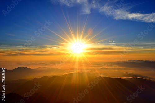 Breathtaking sunrise above the clouds, casting a golden hue over the silhouetted mountains #792058360