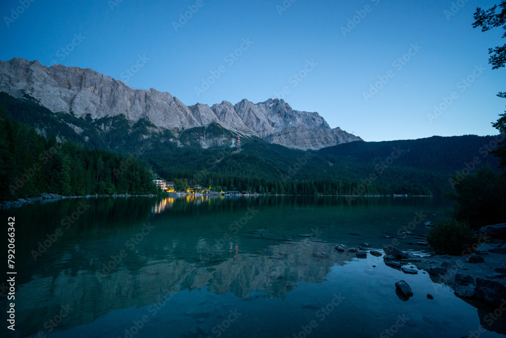 Lake eibsee at dusk with still water reflection