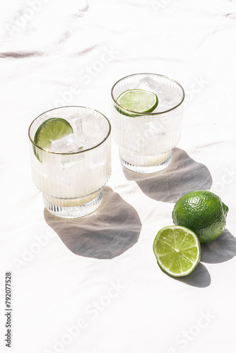 Margarita Soda Water Beverage Summertime Cocktail with Lime on Solid Bright White Background