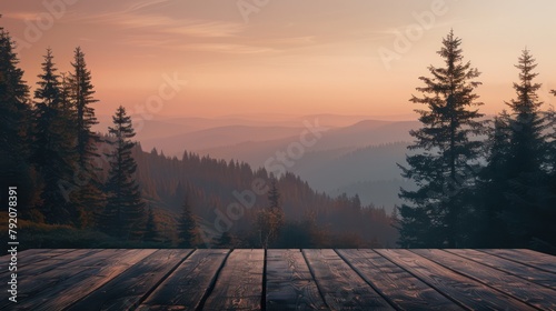 Serene morning view of forested mountains with layers of mist, foreground showing an inviting empty wooden table