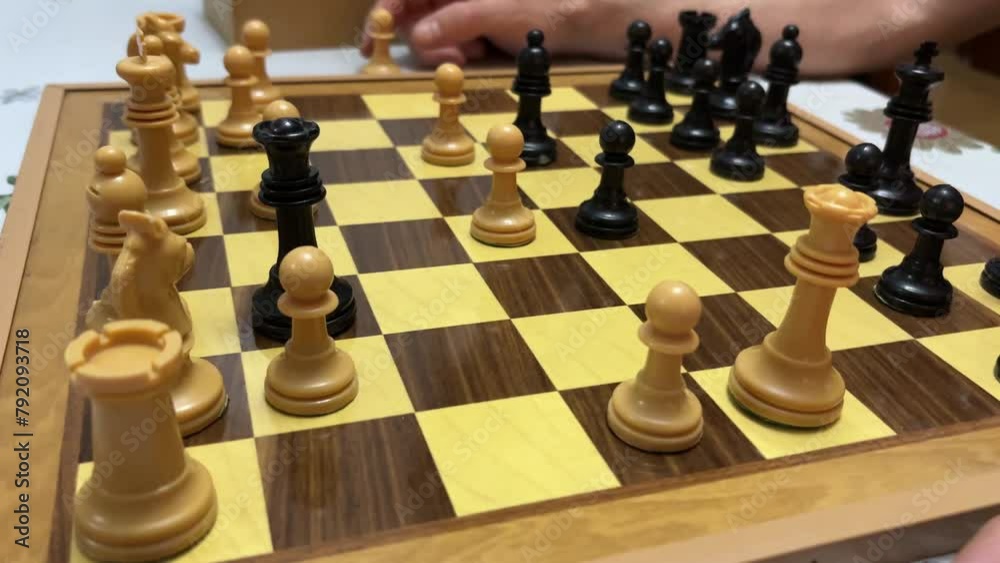 Intense Chess Play. Two unidentified kids deeply engaged in strategic chess moves, fostering critical thinking and concentration. Intense Chess Play. Two unidentified kids deeply engaged in strategic chess moves, fostering critical thinking and concentration.