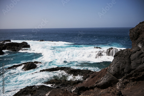Black bay with blue ocean in Tenerife   black voulcanic sand