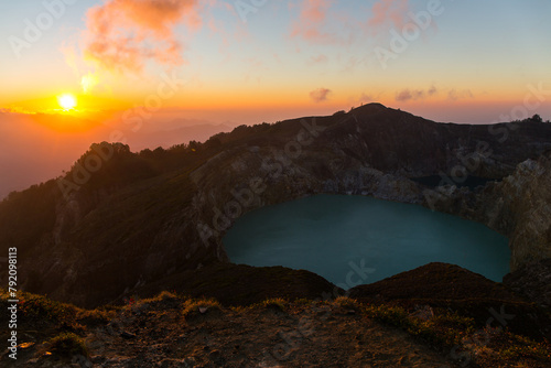 Sunrise view at the top of Kelimutu volcano in Indonesia on the island Flores photo