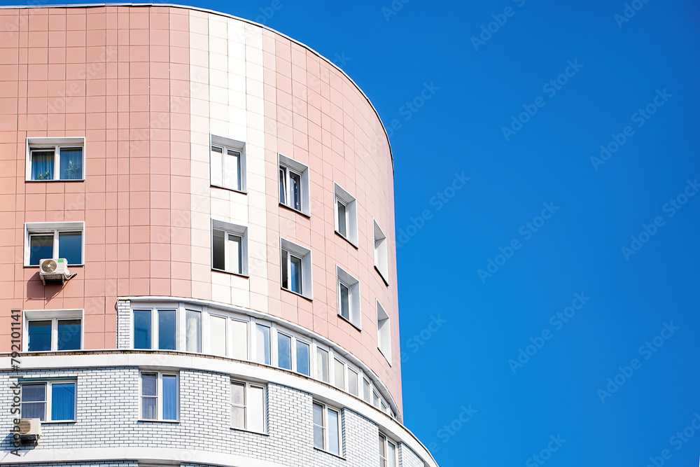 Modern multi-storey building against the blue sky. Modern multi-storey building against the blue sky.