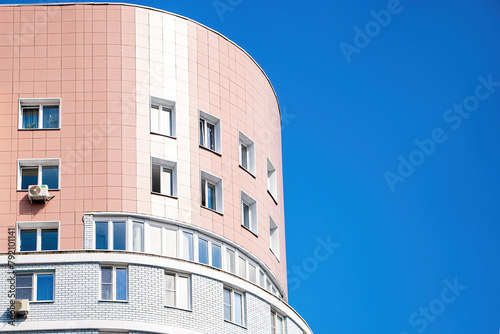 Modern multi-storey building against the blue sky.