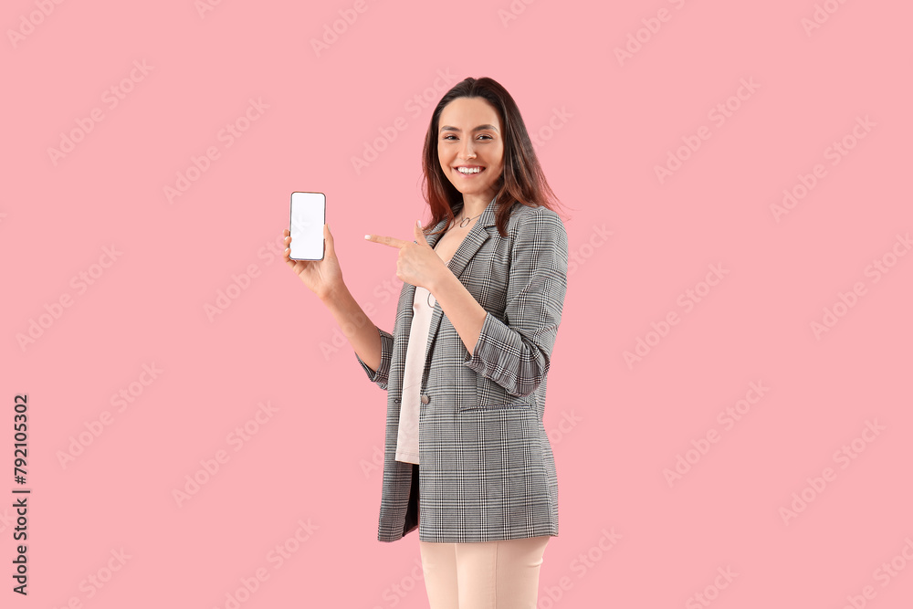 Pretty young woman with smartphone on pink background Pretty young woman with smartphone on pink background