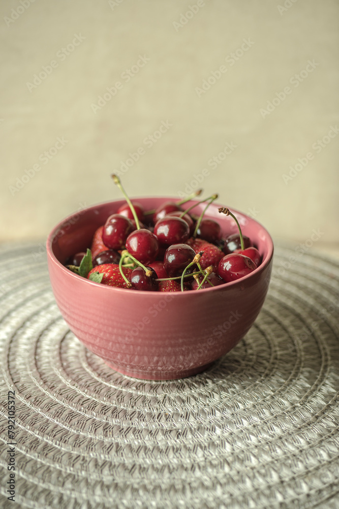 Fresh fruit in a bowl. Strawberries and cherries Fresh fruit in a bowl. Strawberries and cherries