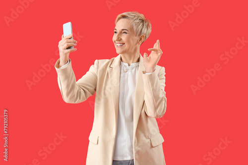 Happy mature woman with sma...