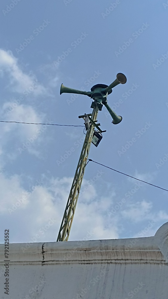 Echoes of History: Classic WWII Air Raid Siren Pole from Below Echoes of History: Classic WWII Air Raid Siren Pole from Below