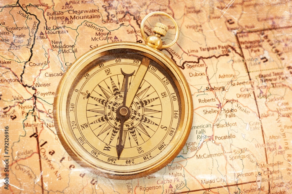 Magnetic retro compass on old map for travel