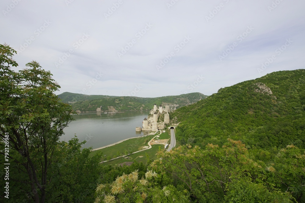 view from the mountain to the Golubac Fortress, landscape with a river, a castle and mountains