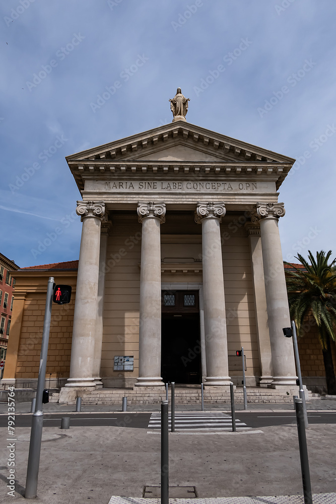 Obraz premium The Notre-Dame-du-Port de Nice church (1840 - 1853), also known as the Immaculate Conception church, is located on Place Ile-de-Beaute, in the Lympia port district. Nice, France.