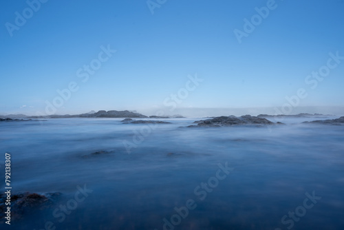 Long exposure waves wash over the keiki tide pools at Hulopoe Beach © Brendan