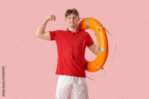 Male lifeguard with lifebuo...