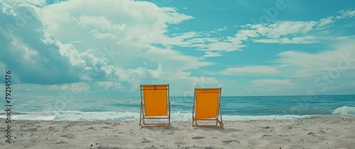 Two Orange Chairs on Sandy Beach