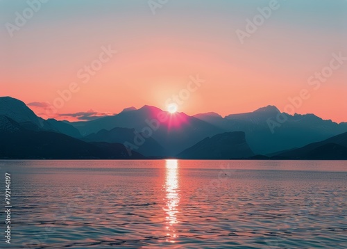 Sunset Over Lake With Mountains in Background