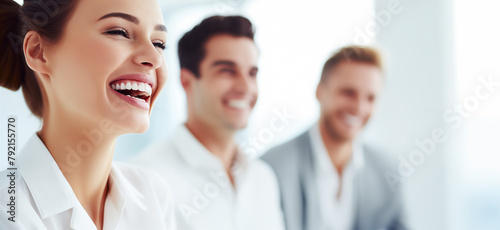 Group of Business Professionals Sharing a Laugh in a Bright Office Environment. Smiling Business Colleagues. Teamwork and Positive Work Culture Concept photo