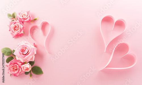 Love, Valentine, mother and women's day concept made from pink paper hearts, roses and the text on pastel background.