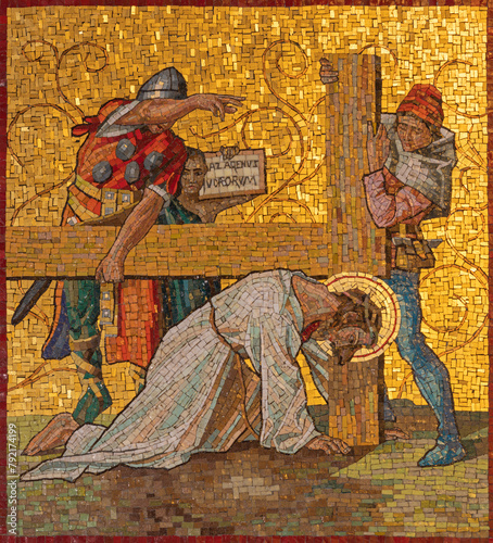 MILAN, ITALY - MARCH 4, 2024: The mosaic Fall of Jesus under the cross as part of Cross way station in church Chiesa di San Agostino by unknown artist of 20. cent. © Renáta Sedmáková