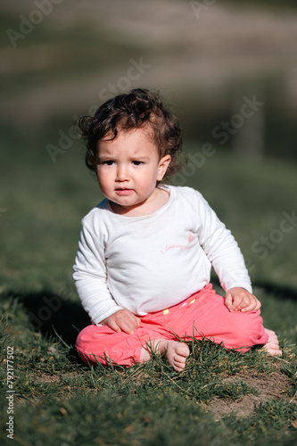 Portrait of a one year old baby in the forest.