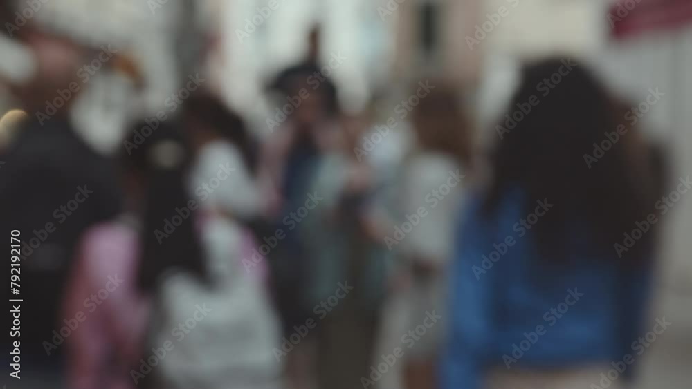 A blurred image capturing dynamic movement of city life with unrecognizable figures and bokeh lights creating an urban atmosphere A blurred image capturing dynamic movement of city life with unrecognizable figures and bokeh lights creating an urban atmosphere