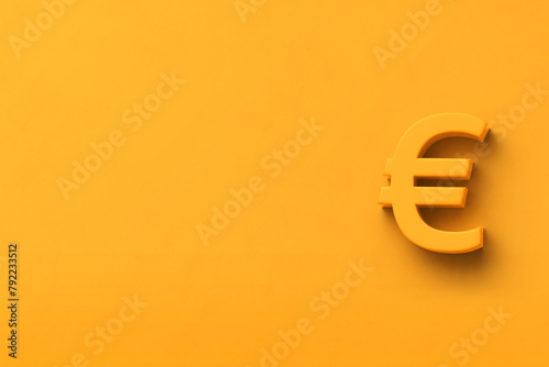 Yellow background with text space and a 3D euro symbol photo