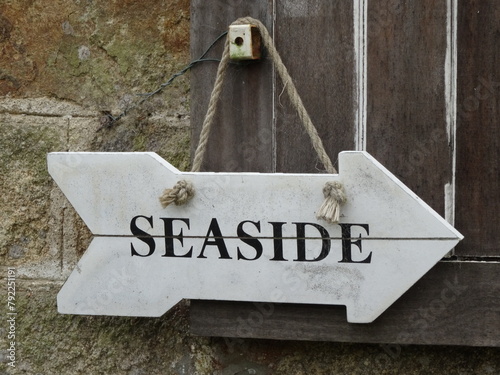hanging wooden sign for seaside photo