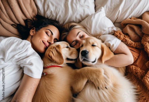 couple with dogs in the bed