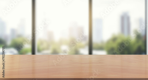 Wooden table in sunny office with big window