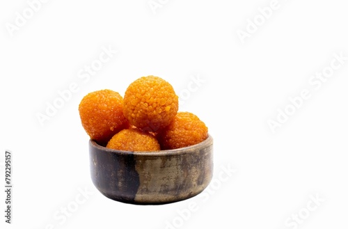 Motichoor Laddu or Motichur Laddoo in a Wooden Bowl Isolated on White Background with Copy Space, Also Known as Bundi Ladoo