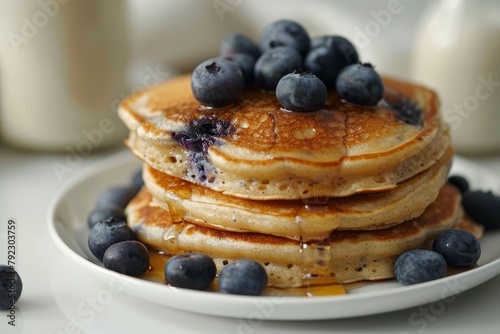 Gluten free pancakes with fresh blueberries on top. Blueberry pancake tower on white round plate. Milk bottle as background. Selective focus - generative ai
