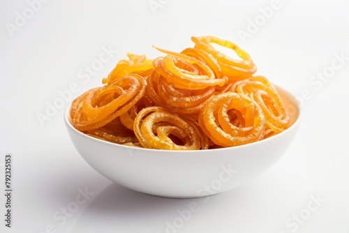 Gathiya fafda jalebi is a popular Gujarati snack served in a white bowl on a white background commonly found in pouch packaging as a street snack from India