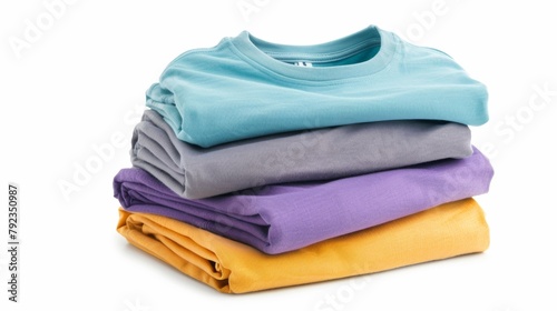 Neatly stacked colorful t-shirts isolated on a white background, concept of apparel.